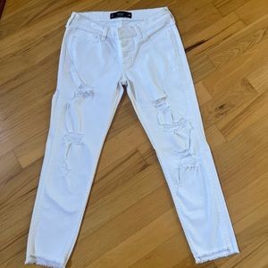 White distressed denim jeans by Hollister.